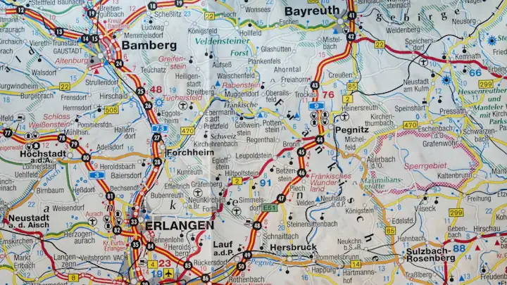 A folded road map spread out with routes and town names