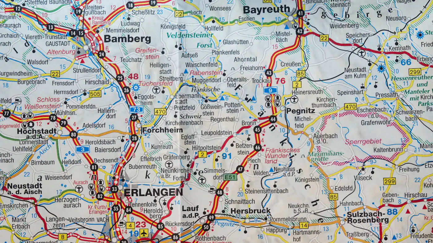 A printed road map with motorways and town names around Bamberg and Erlangen